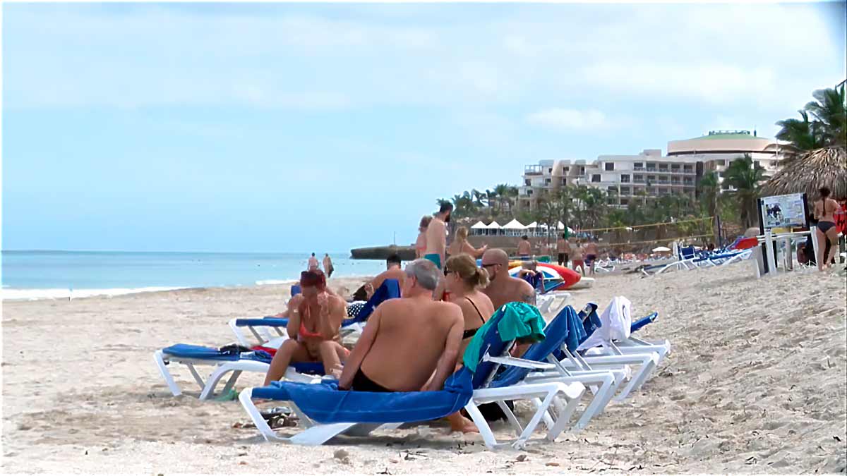 Russian tourists on a beach in Cuba